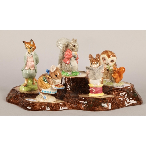 183 - Ten Beswick Beatrix Potter figurines with display base