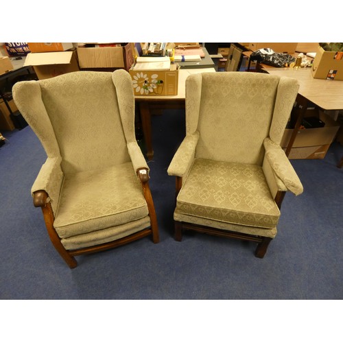 502 - Two oak frame wing back arm chairs.