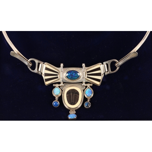 171 - Robert Crerar (Scottish) Silver torque necklace with opals, inlaid fans and drop, approximately 67.5... 