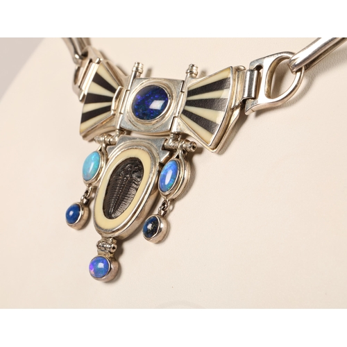 171 - Robert Crerar (Scottish) Silver torque necklace with opals, inlaid fans and drop, approximately 67.5... 