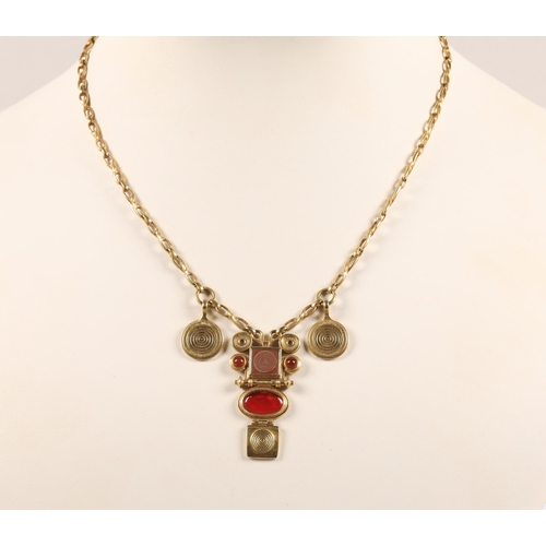 172 - Robert Crerar (Scottish) 18ct gold necklace of Egyptian inspiration with amber-style stone and whorl... 