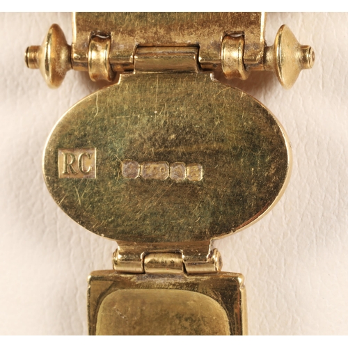 172 - Robert Crerar (Scottish) 18ct gold necklace of Egyptian inspiration with amber-style stone and whorl... 