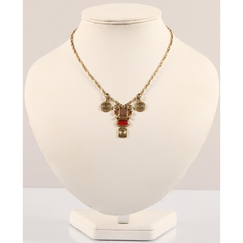 172 - Robert Crerar (Scottish) 18ct gold necklace of Egyptian inspiration with amber-style stone and whorl... 