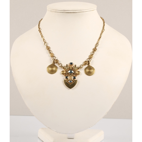 175 - Robert Crerar (Scottish) 18ct gold necklace of Egyptian inspiration with spear-shaped drop set with ... 