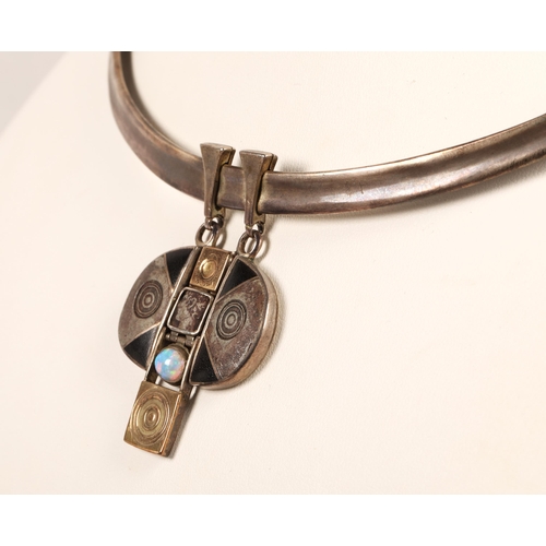 173 - Robert Crerar (Scottish) Silver torque necklace with opal and inlaid drop, 50g gross.... 