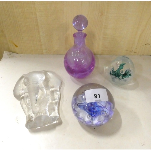 91 - Three paperweights and Caithness scent bottle.