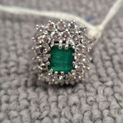 123 - Emerald Diamond cluster ring on white metal shank, ring size M