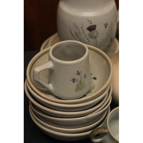 28 - Buchan Studio Pottery stoneware thistle decorated pottery to include jugs, cups, etc.