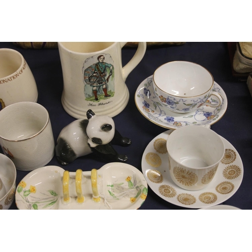 37 - Porcelain cups and saucers to include Porsgrund of Norway, a Lomonosov panda, etc.