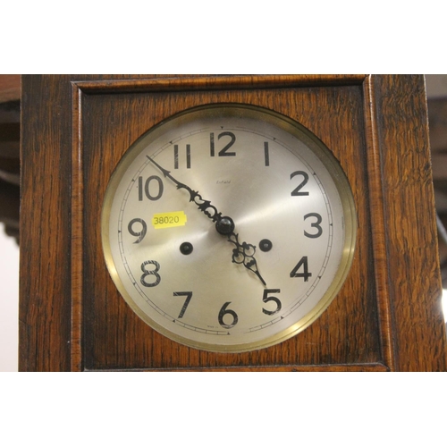 39 - 1930s Art Deco oak cased wall clock.