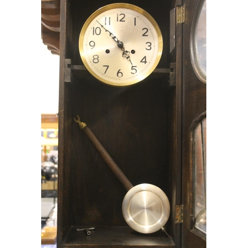 39 - 1930s Art Deco oak cased wall clock.