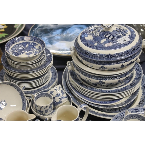 48 - Wedgwood blue and white willow pattern pottery to include teapot, tureens, jugs, etc.