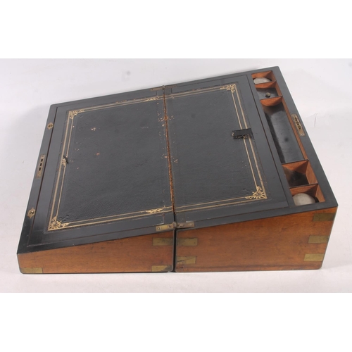 64 - Late Victorian walnut and brass bound writing slope, 50cm wide.