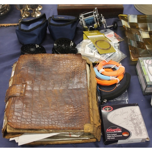 68 - Fishing equipment to include sea reels, Airflo Millennium reels, and a leather bound book of old sal... 