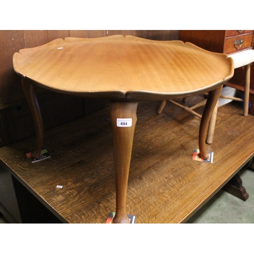 694 - Mahogany Whytock and Reid style occasional table raised on cabriole supports.