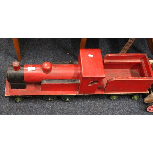 718 - Red painted child's wooden train model.