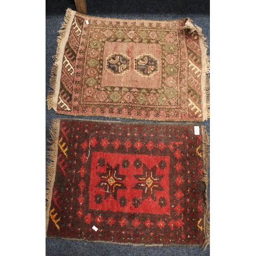 724 - Small red ground fringed rug and another similar.