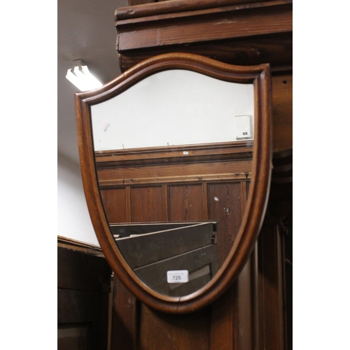 725 - Mahogany shield shaped mirror.