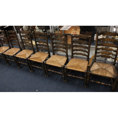 735 - Set of eight (6+2) ladderback rush seat dining chairs.