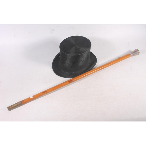 125 - Victorian Malacca cane with Indian white metal top, and a top hat (2)