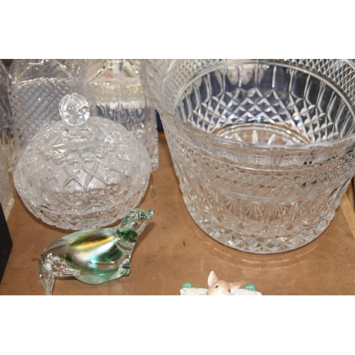 132 - Glass ware to include a bowl, decanters, a paperweight, etc.