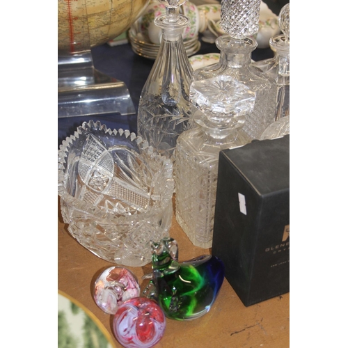 132 - Glass ware to include a bowl, decanters, a paperweight, etc.