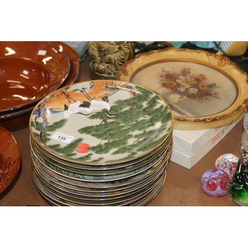 135 - Collectors plates, a green glazed figure of a Chinese man, a pottery lamp base, etc.