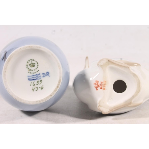 146 - Royal Copenhagen floral decorated vase and a Lomonosov bird model.