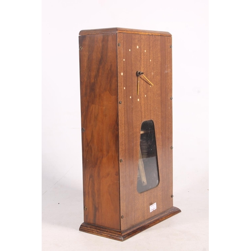 153 - Meccano wooden cased mantle clock.