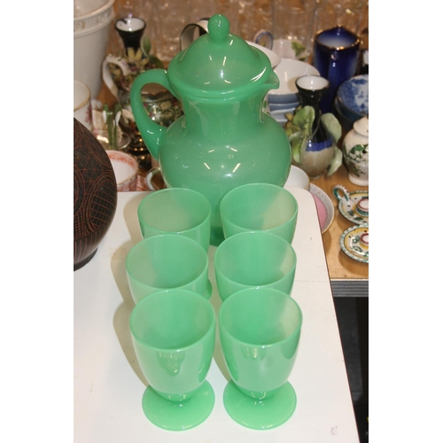 163 - Green glass lemonade set comprising jug and six tumblers.