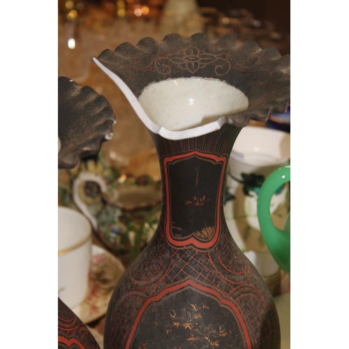 165 - A pair of black ground oriental vases with wavy edge rims (a/f) and a kutani vase.