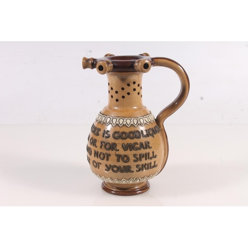 178 - Doulton stoneware puzzle jug, the body with tubelined motto 'Within this jug there is good liquor 'T... 