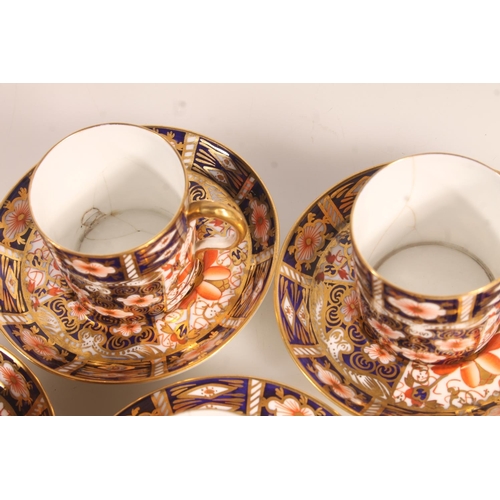 202 - Six Royal Crown Derby Imari 2451 pattern coffee cups and saucers.