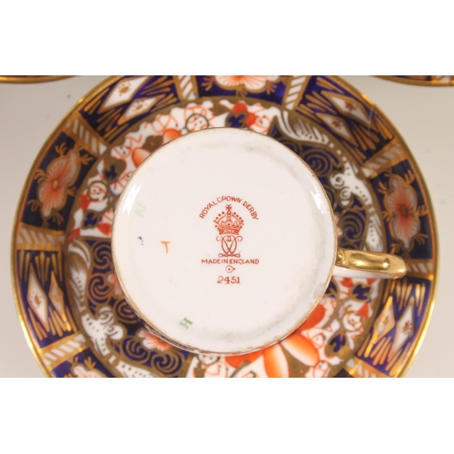 202 - Six Royal Crown Derby Imari 2451 pattern coffee cups and saucers.