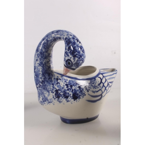 207 - Late 18thC porcelain blue and white willow pattern teapot, a modern pottery blue and white duck vase... 