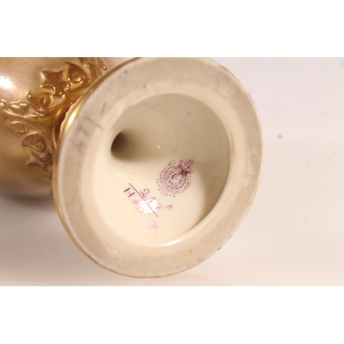 225 - Royal Worcester porcelain urn painted with peacock design, signed by Sedgley, H22cm.