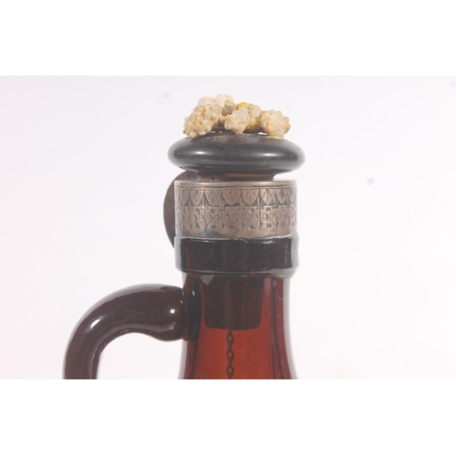 236 - German 19thC brown glass bottle with attached silver Whisky decanter label, H21cm.