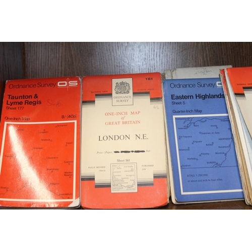 242 - Shelf containing ordnance survey maps.