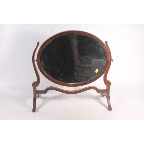 249 - Mahogany oval dressing glass mirror.