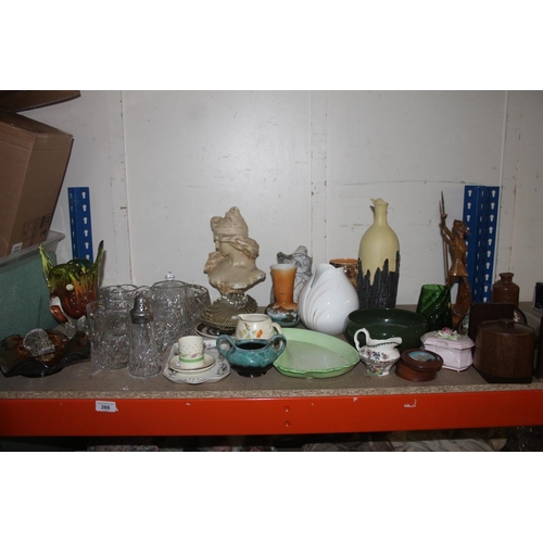 268 - Shelf containing decorative ceramics, globe bookends, glassware, etc.