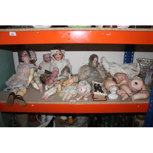 275 - Shelf containing antique ceramic dolls to include German stamp, etc.