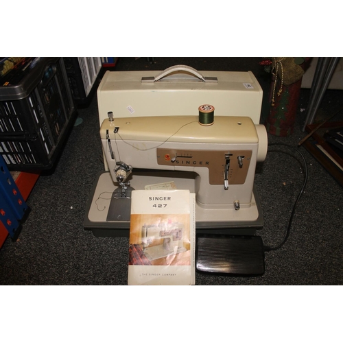 294 - Cased Singer sewing machine.