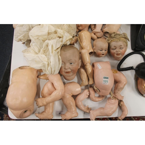 81 - Bisque headed dolls and doll parts.