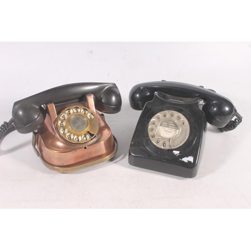 83 - Rtt-56 copper clad telephone, and a black Bakelite telephone.