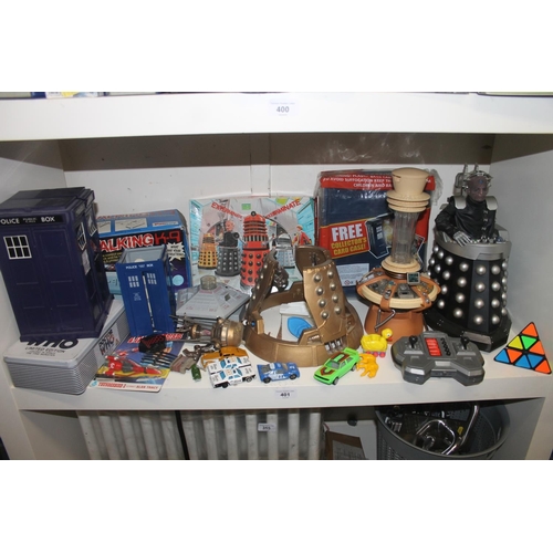 Collection of toys to include Dr Who tardis, remote control figure, etc.