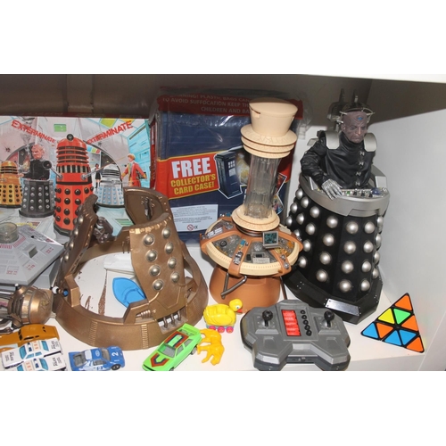 Collection of toys to include Dr Who tardis, remote control figure, etc.