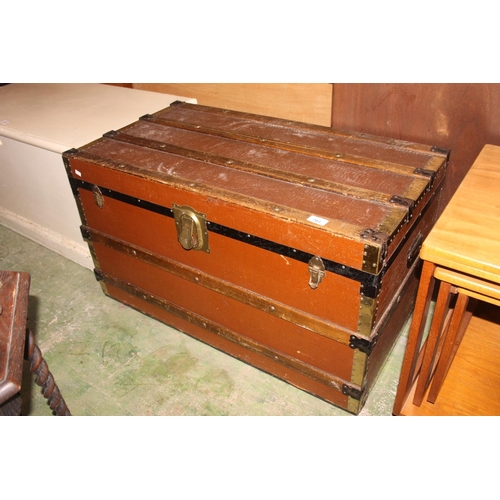 703 - Wood and brass bound trunk.