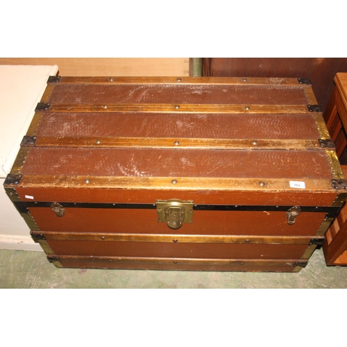 703 - Wood and brass bound trunk.