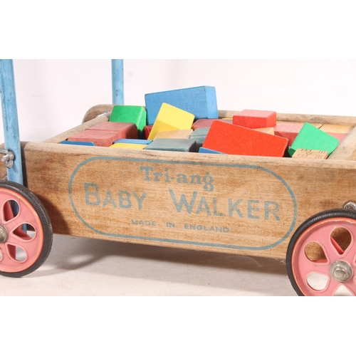 719 - Triang baby walker with blocks.