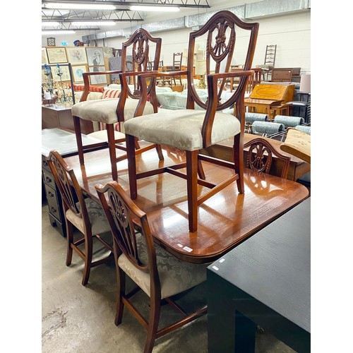 610 - Mahogany extending dinning table with four chairs and two carvers